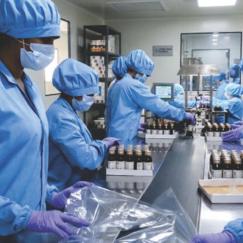 worker packing bottle